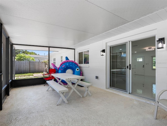302 Patty Dr, Oldsmar, FL 34677 - sunroom with healthy amount of natural light and outdoor dining area
