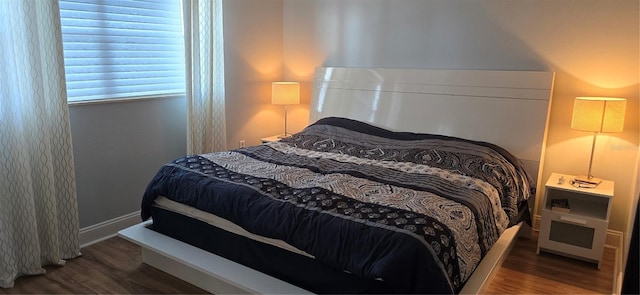 bedroom featuring wood finished floors