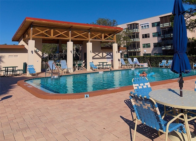 community pool with a patio area