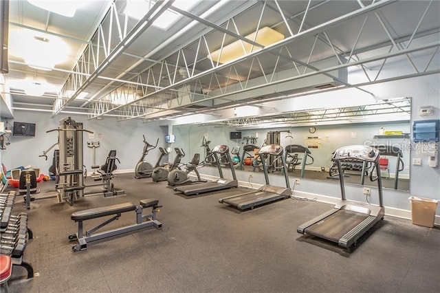 exercise room with baseboards