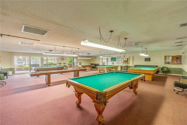 rec room featuring carpet flooring, billiards table, a textured ceiling, and healthy amount of natural light