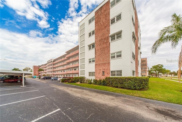 5501 80th St N Unit 207, Saint Petersburg, FL 33709 - view of apartment building / complex with uncovered parking