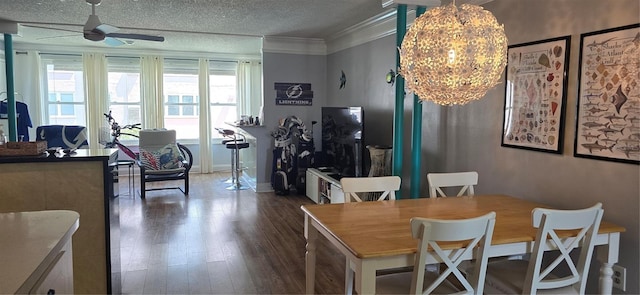 5501 80th St N Unit 207, Saint Petersburg, FL 33709 - dining space with ceiling fan, dark wood-type flooring, ornamental molding, a chandelier, and a textured ceiling