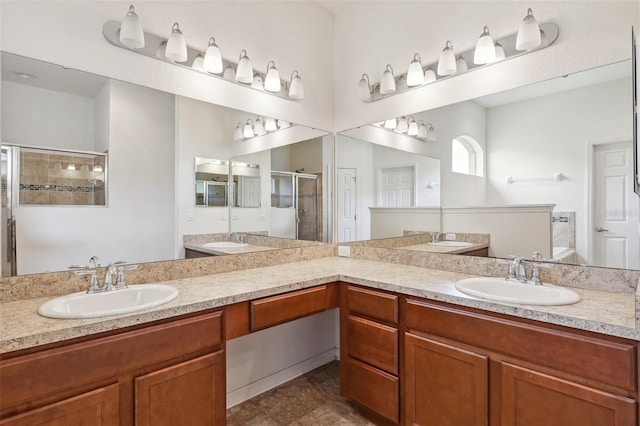 full bathroom with a stall shower and double vanity