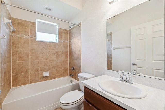 full bathroom featuring toilet, bathing tub / shower combination, and vanity