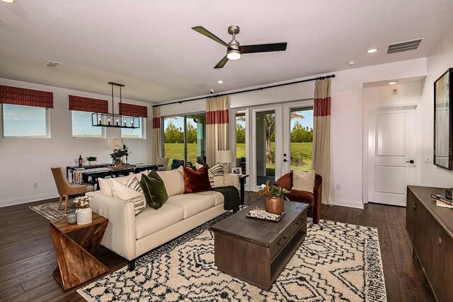 17020 Cercis Loop, Clermont, FL 34711 - living room with baseboards, dark wood-type flooring, ceiling fan, french doors, and recessed lighting