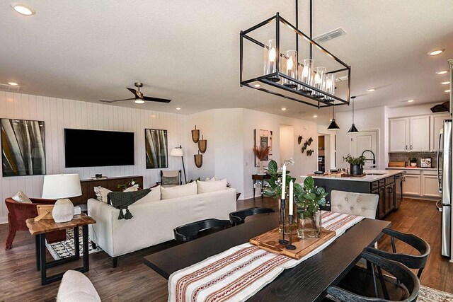 17020 Cercis Loop, Clermont, FL 34711 - dining room featuring dark wood-type flooring, a ceiling fan, and recessed lighting