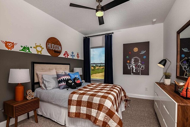 17020 Cercis Loop, Clermont, FL 34711 - bedroom featuring carpet, baseboards, a textured ceiling, and a ceiling fan