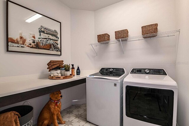17020 Cercis Loop, Clermont, FL 34711 - clothes washing area with separate washer and dryer and light flooring
