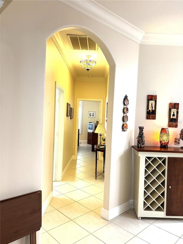19420 Haskell Pl, Land O Lakes, FL 34638 - corridor with light tile patterned floors, arched walkways, crown molding, and baseboards