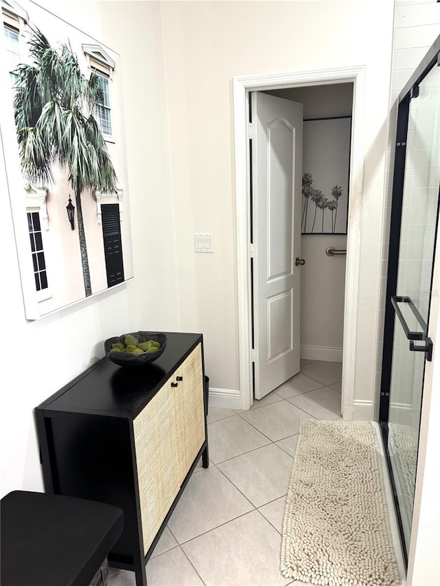 19420 Haskell Pl, Land O Lakes, FL 34638 - full bathroom with baseboards, tile patterned flooring, a stall shower, and vanity