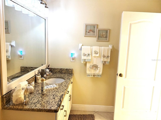 19420 Haskell Pl, Land O Lakes, FL 34638 - bathroom with tile patterned flooring, vanity, and baseboards