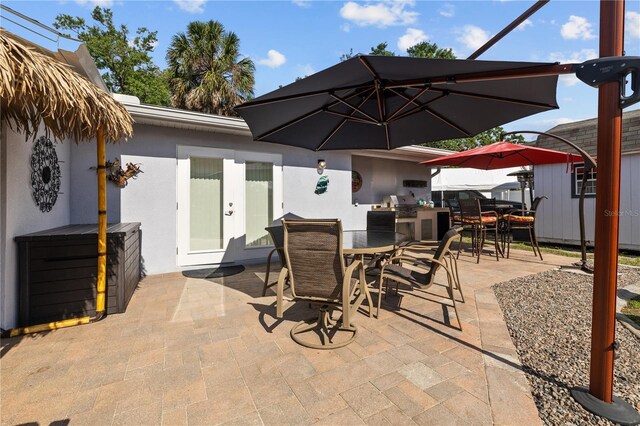 905 W Fribley St, Tampa, FL 33603 - view of patio featuring outdoor dining area and area for grilling