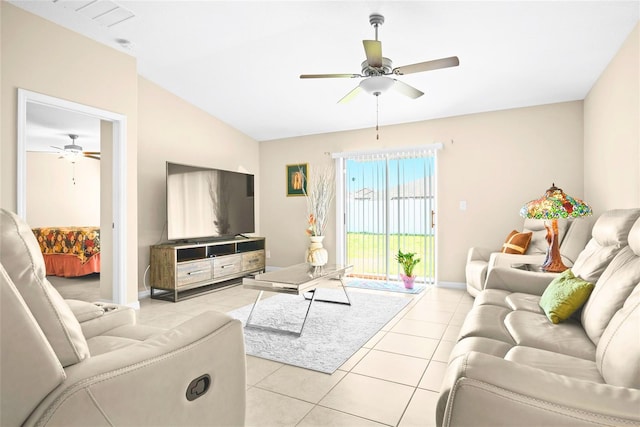 742 8th St NW, Ruskin, FL 33570 - living room featuring a ceiling fan, light tile patterned floors, lofted ceiling, and baseboards