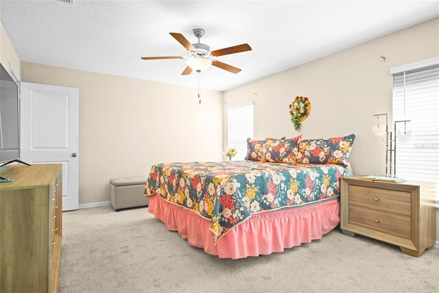 742 8th St NW, Ruskin, FL 33570 - bedroom featuring light carpet, ceiling fan, and baseboards