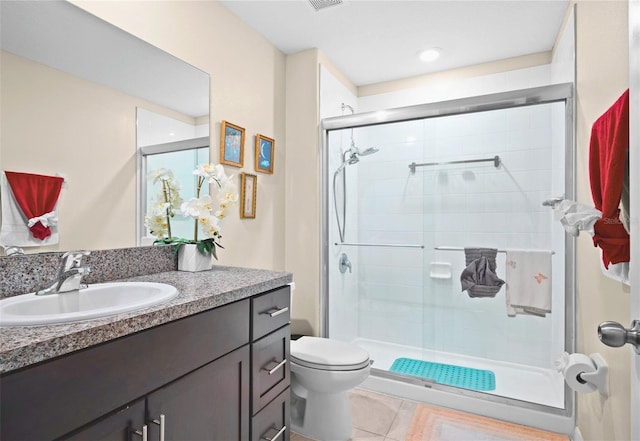 742 8th St NW, Ruskin, FL 33570 - full bathroom featuring toilet, a stall shower, vanity, and tile patterned flooring
