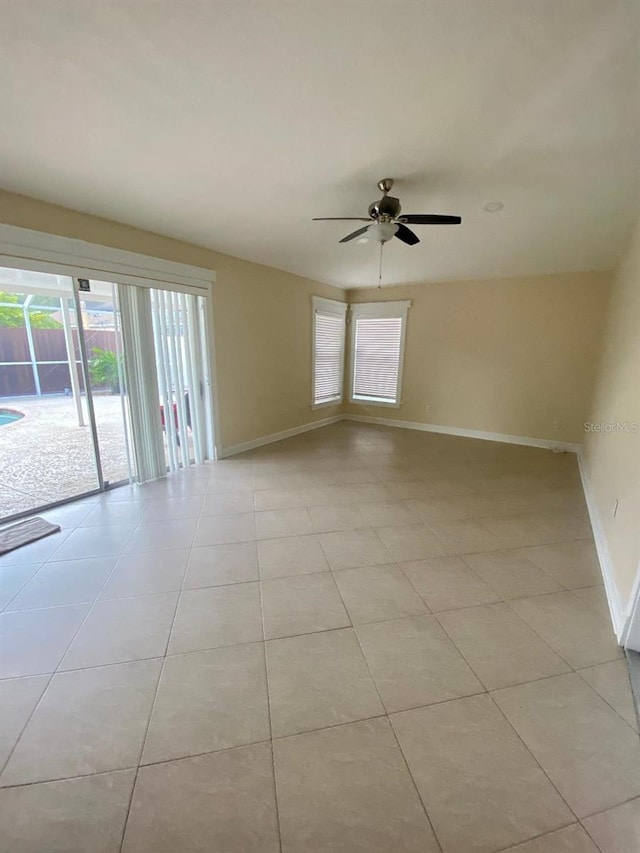 11014 Peking Pl, Tampa, FL 33624 - empty room with baseboards, ceiling fan, and light tile patterned floors