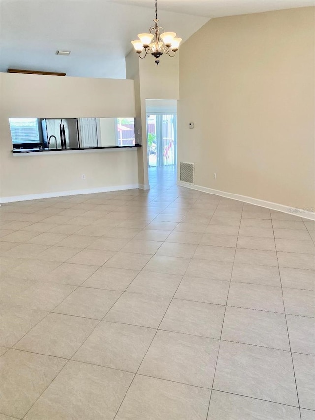 11014 Peking Pl, Tampa, FL 33624 - unfurnished room featuring a chandelier, high vaulted ceiling, light tile patterned floors, and baseboards