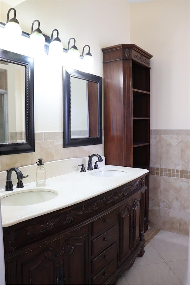 11014 Peking Pl, Tampa, FL 33624 - bathroom featuring double vanity, tile walls, and tile patterned flooring