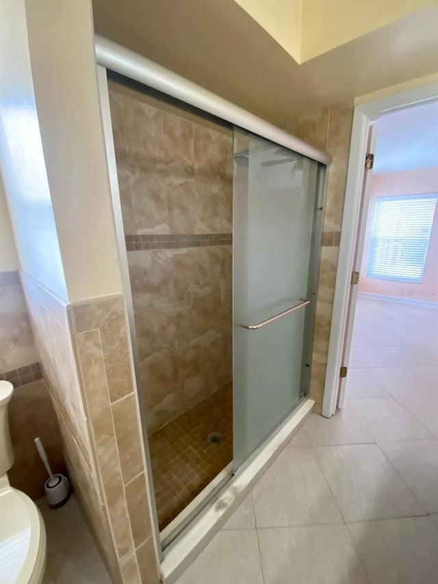11014 Peking Pl, Tampa, FL 33624 - bathroom with toilet, a shower stall, and tile patterned floors