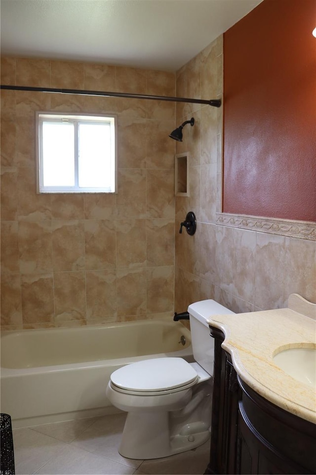 11014 Peking Pl, Tampa, FL 33624 - bathroom featuring vanity, toilet, shower / bath combination, and tile walls