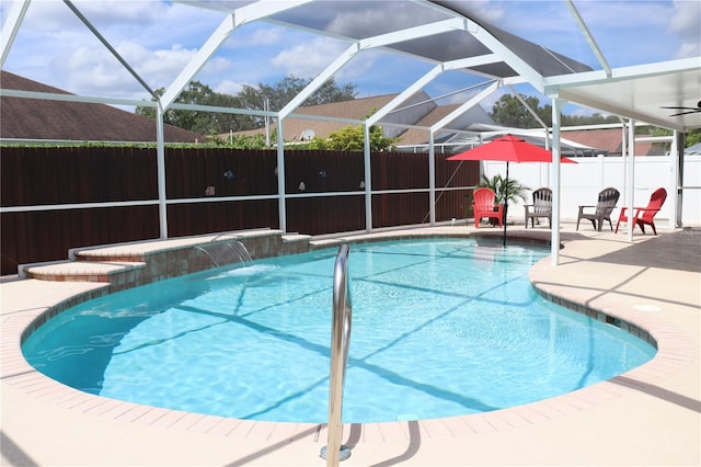 11014 Peking Pl, Tampa, FL 33624 - view of pool featuring a fenced backyard, a patio, and glass enclosure