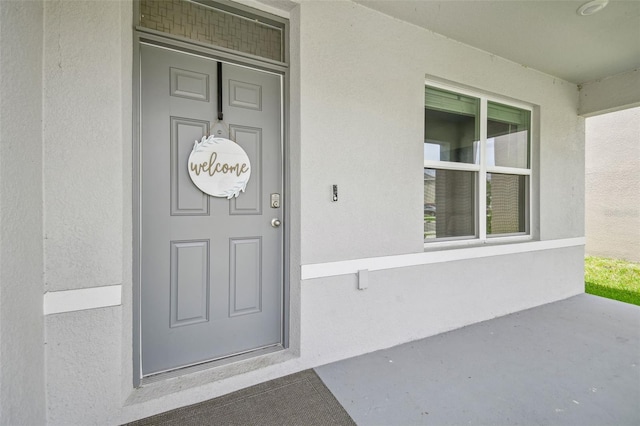 33524 Elm Hill Br, Wesley Chapel, FL 33545 - doorway to property featuring stucco siding