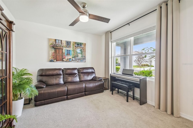 33524 Elm Hill Br, Wesley Chapel, FL 33545 - living room featuring light colored carpet, a ceiling fan, and baseboards