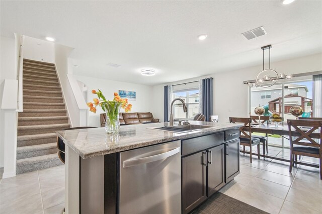 33524 Elm Hill Br, Wesley Chapel, FL 33545 - kitchen featuring dishwasher, a sink, a center island with sink, decorative light fixtures, and recessed lighting