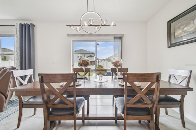 33524 Elm Hill Br, Wesley Chapel, FL 33545 - dining room with a chandelier and light tile patterned floors
