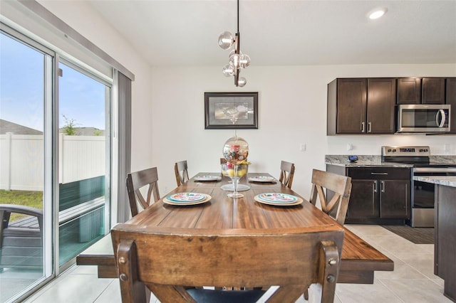 33524 Elm Hill Br, Wesley Chapel, FL 33545 - dining space with light tile patterned floors and recessed lighting