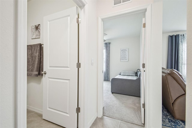 33524 Elm Hill Br, Wesley Chapel, FL 33545 - hall featuring light tile patterned floors, baseboards, and light colored carpet