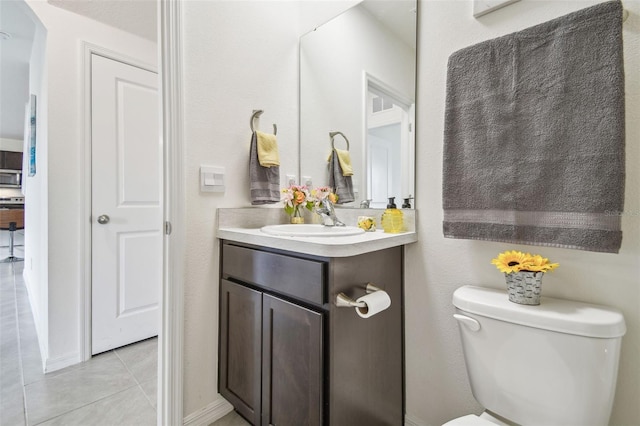 33524 Elm Hill Br, Wesley Chapel, FL 33545 - bathroom featuring tile patterned floors, toilet, and vanity