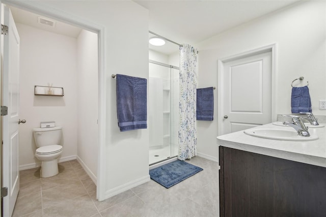 33524 Elm Hill Br, Wesley Chapel, FL 33545 - bathroom featuring a sink, a shower stall, toilet, tile patterned flooring, and baseboards