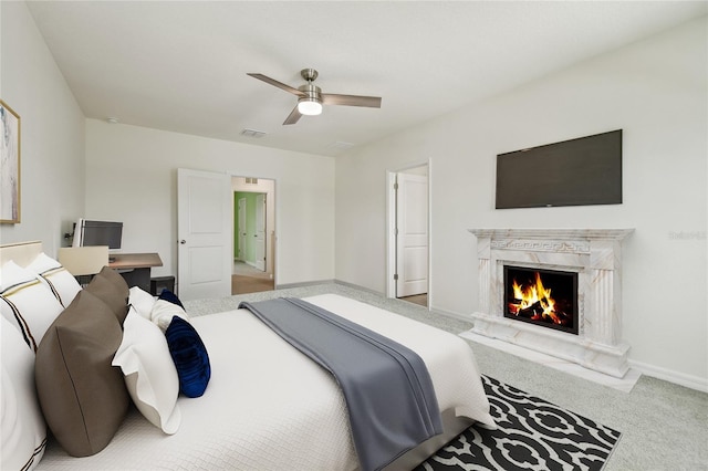 33524 Elm Hill Br, Wesley Chapel, FL 33545 - carpeted bedroom with a premium fireplace, baseboards, and a ceiling fan
