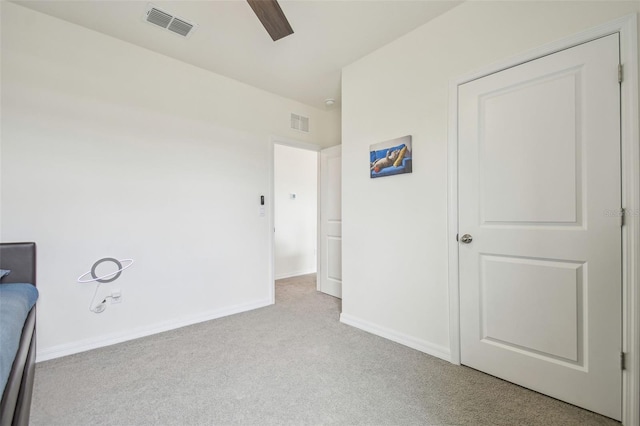 33524 Elm Hill Br, Wesley Chapel, FL 33545 - unfurnished bedroom with carpet, baseboards, and a ceiling fan