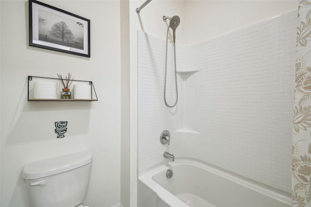 33524 Elm Hill Br, Wesley Chapel, FL 33545 - bathroom featuring toilet, shower / washtub combination, and baseboards