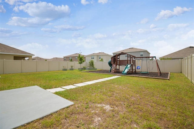 33524 Elm Hill Br, Wesley Chapel, FL 33545 - view of yard featuring a playground and a patio area