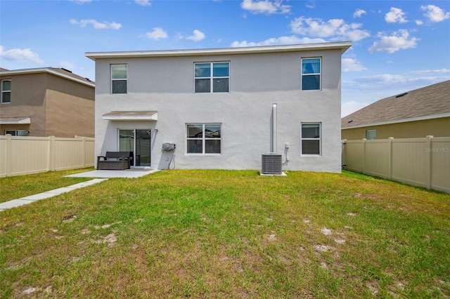 33524 Elm Hill Br, Wesley Chapel, FL 33545 - rear view of property featuring stucco siding, a patio, and cooling unit