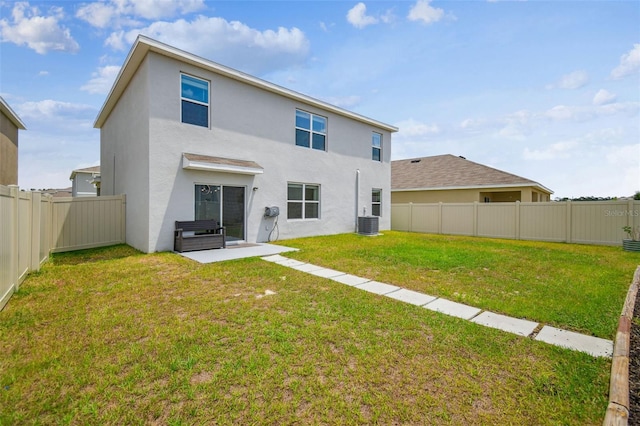 33524 Elm Hill Br, Wesley Chapel, FL 33545 - rear view of house featuring stucco siding, central AC, and a patio area