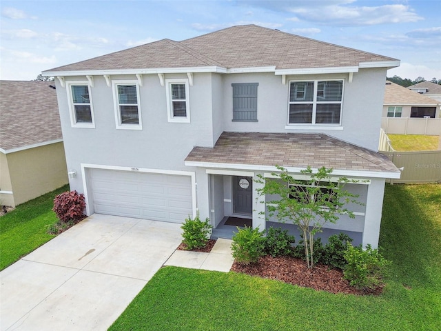 33524 Elm Hill Br, Wesley Chapel, FL 33545 - traditional-style house with a shingled roof, a garage, stucco siding, and driveway