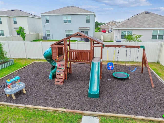 33524 Elm Hill Br, Wesley Chapel, FL 33545 - view of jungle gym with a fenced backyard and central AC
