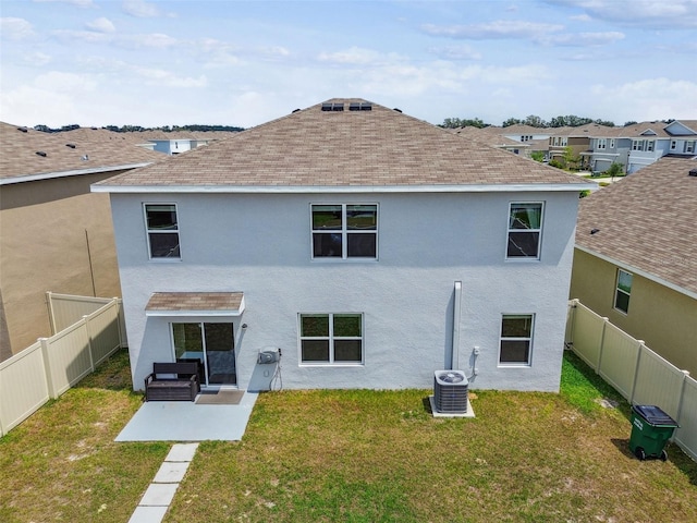 33524 Elm Hill Br, Wesley Chapel, FL 33545 - rear view of property with stucco siding, cooling unit, a shingled roof, and a patio area
