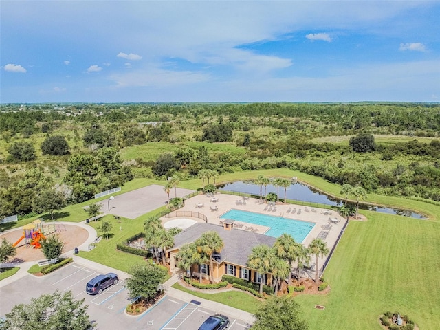 33524 Elm Hill Br, Wesley Chapel, FL 33545 - drone / aerial view of a pool, a heavily wooded area, and a large body of water