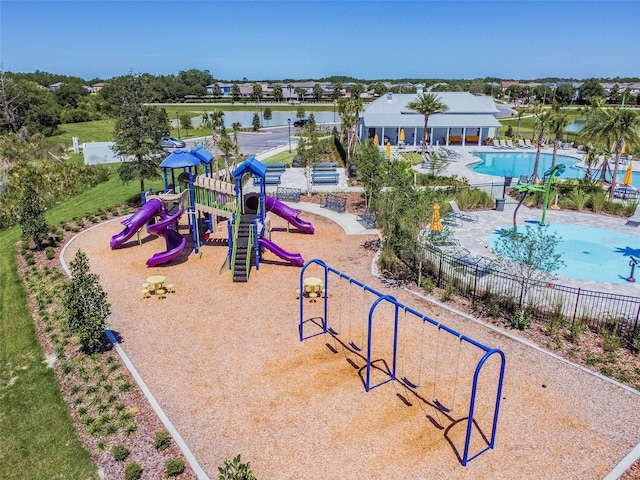 33524 Elm Hill Br, Wesley Chapel, FL 33545 - community play area with fence, a community pool, and a patio area