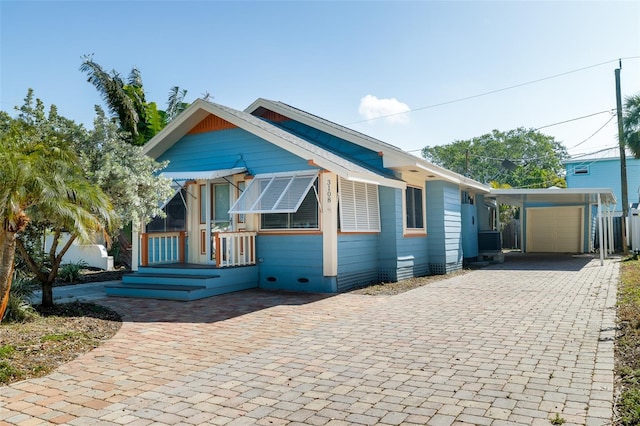 3108 Dupont St S, Gulfport, FL 33707 - view of front of property featuring a garage and decorative driveway