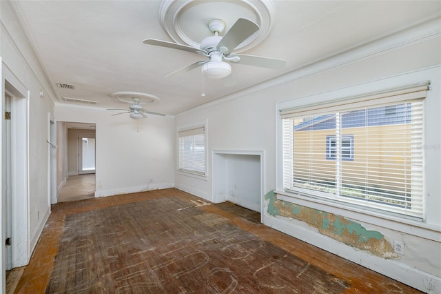 3108 Dupont St S, Gulfport, FL 33707 - unfurnished living room with ceiling fan, ornamental molding, baseboards, and wood finished floors