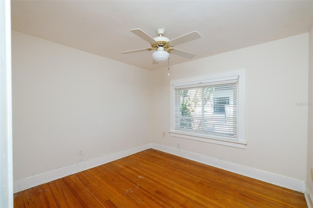 3108 Dupont St S, Gulfport, FL 33707 - spare room with baseboards, wood finished floors, and a ceiling fan