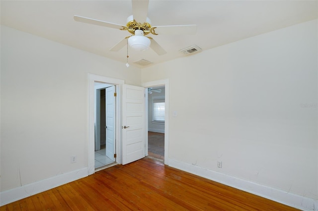 3108 Dupont St S, Gulfport, FL 33707 - empty room featuring wood finished floors, baseboards, and a ceiling fan