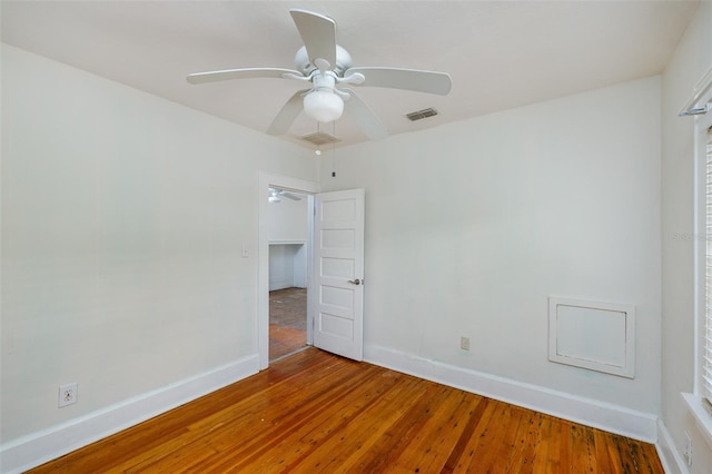 3108 Dupont St S, Gulfport, FL 33707 - unfurnished bedroom featuring wood-type flooring, baseboards, and a ceiling fan